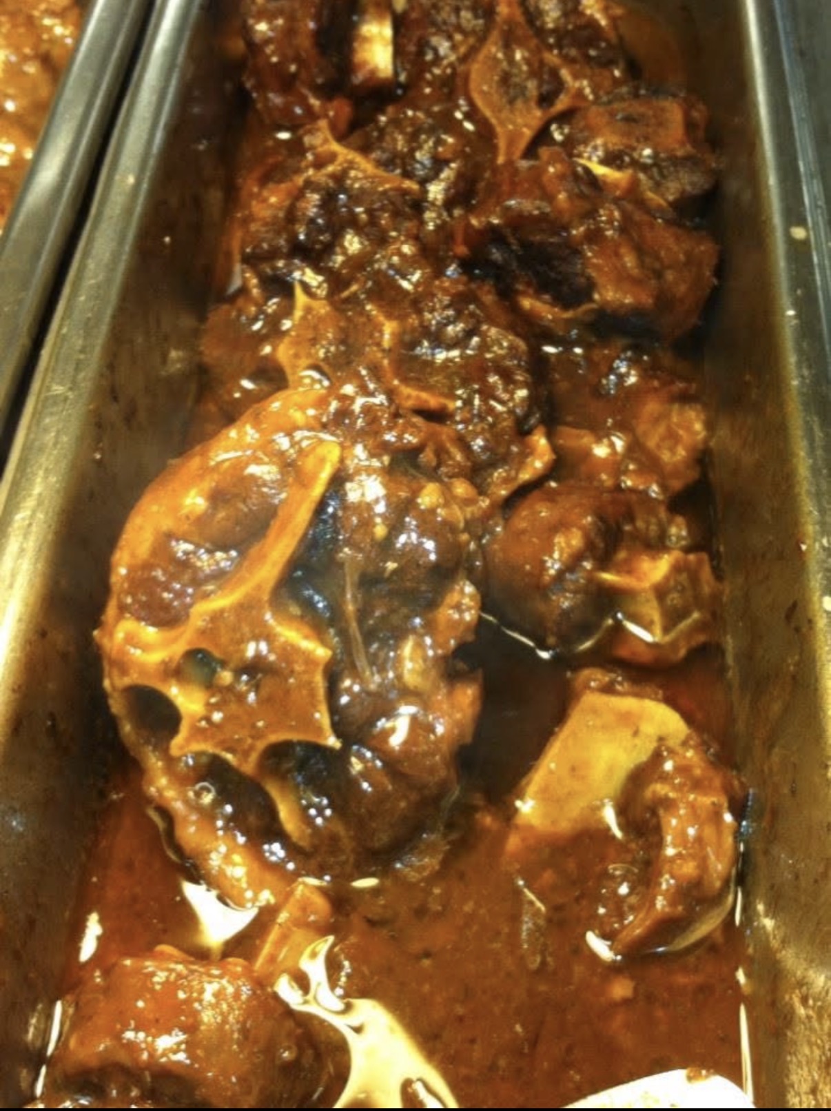 Slow braised oxtails in rich gravy